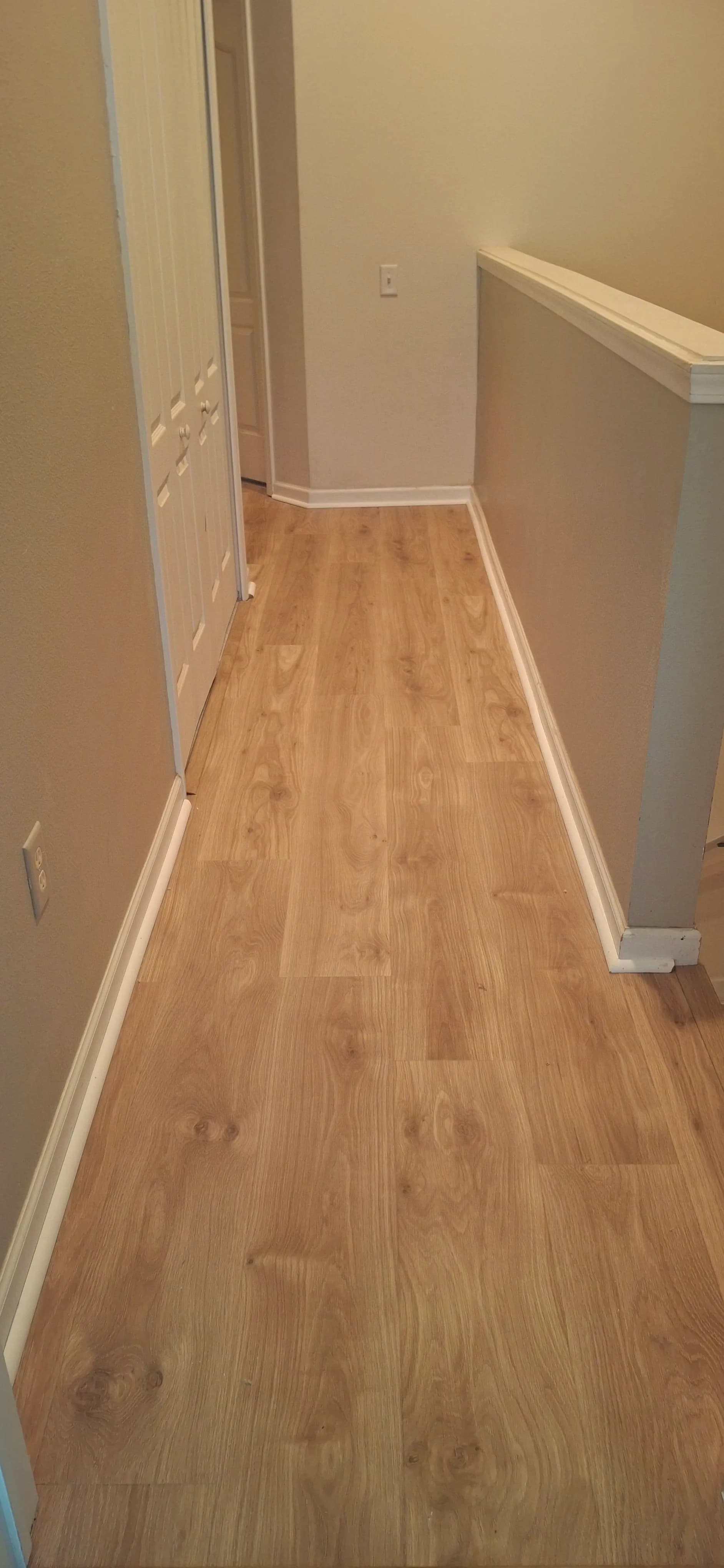 Gallery photos for Upper-Level Hallway Gets a Clean Laminate Flooring Upgrade: Image #1