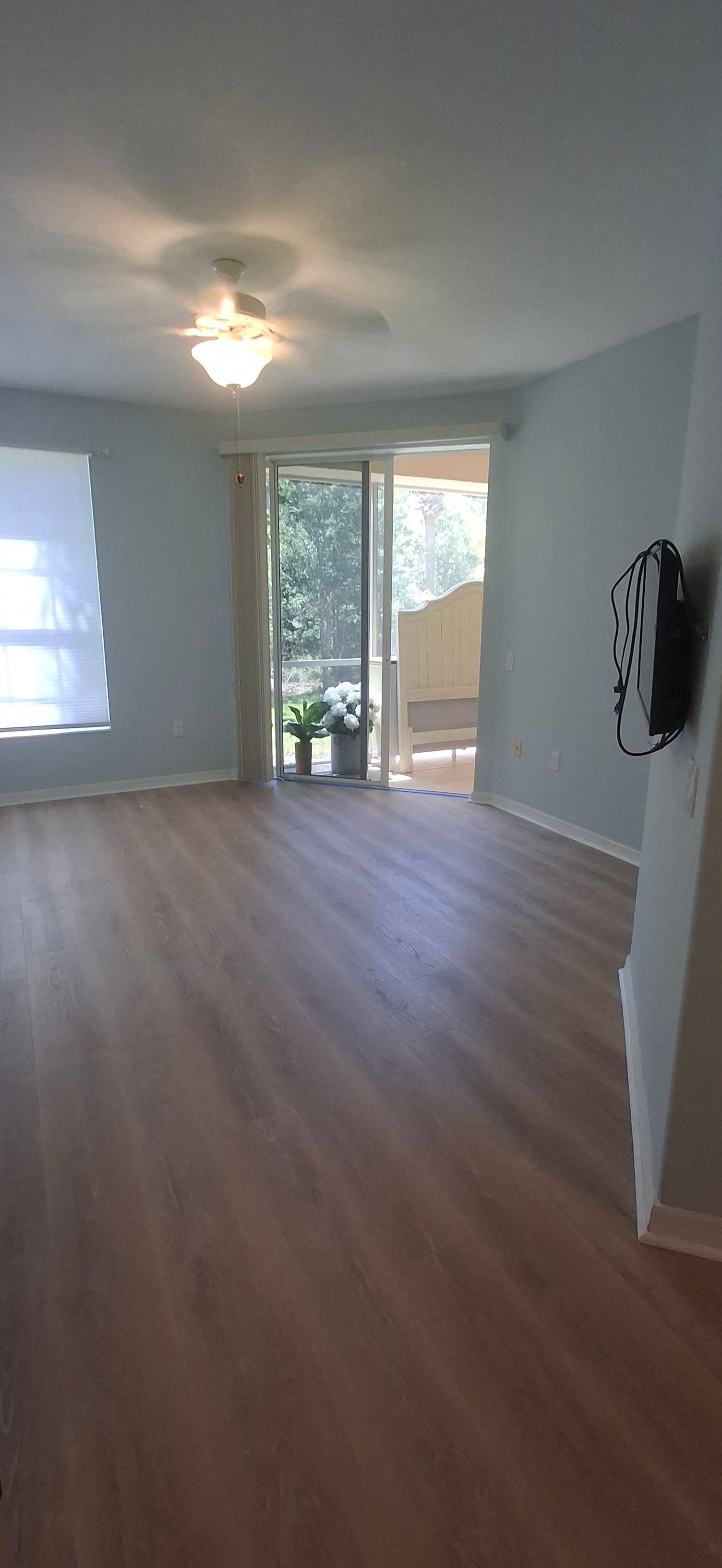 Waterproof Laminate Flooring Installed in a Bright Modern Bedroom image