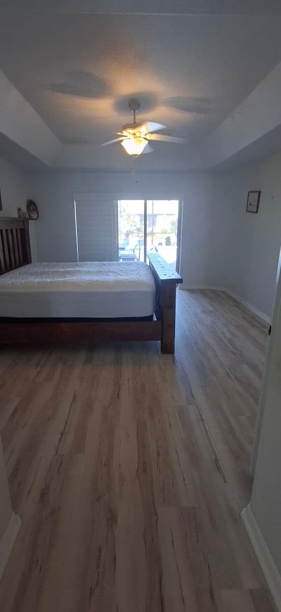 Project Waterproof Vinyl Plank Flooring Installation in a Bradenton Master Bedroom image