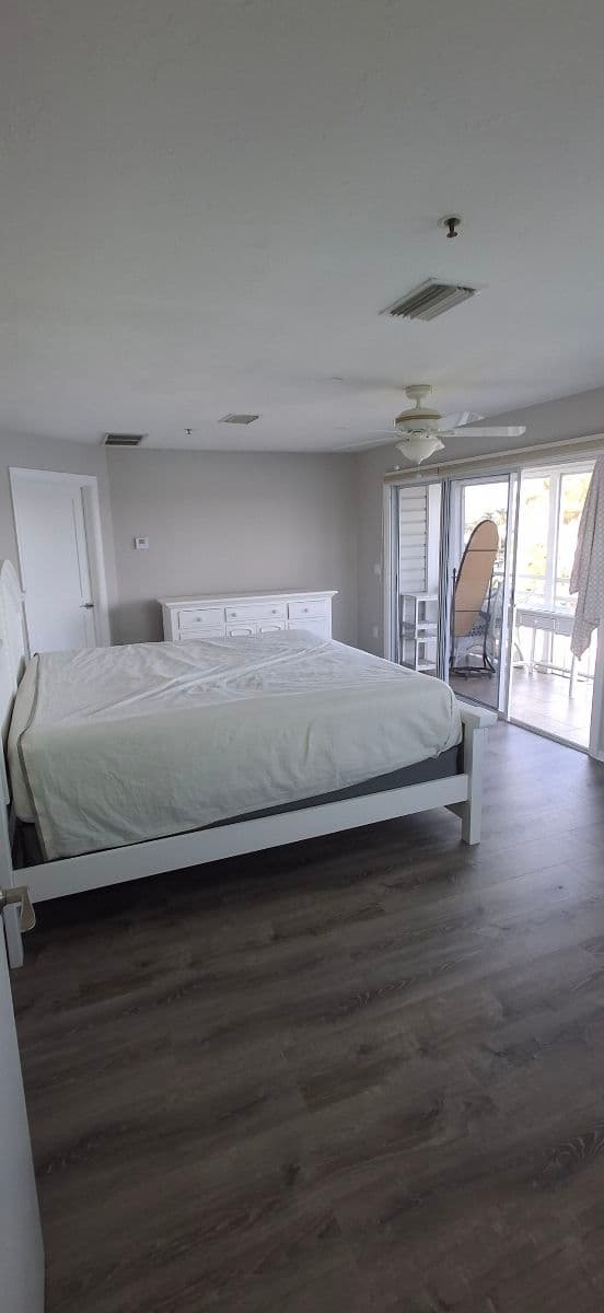 Project Sleek Wood Floors for a Modern Bedroom in Siesta Key image